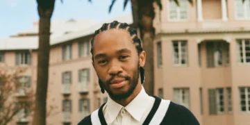 Thebe Magugu on the balcony of the Thebe Magugu Suite at Mount Nelson, a Belmond Hotel. Courtney Patrick/Courtesy of Belmond