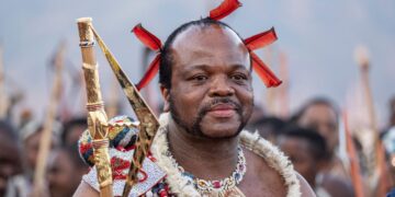 King Mswati III, who took the throne in 1986, arrives in ceremonial dress for the annual reed dance. Photograph: Emmanuel Croset/AFP/Getty Images