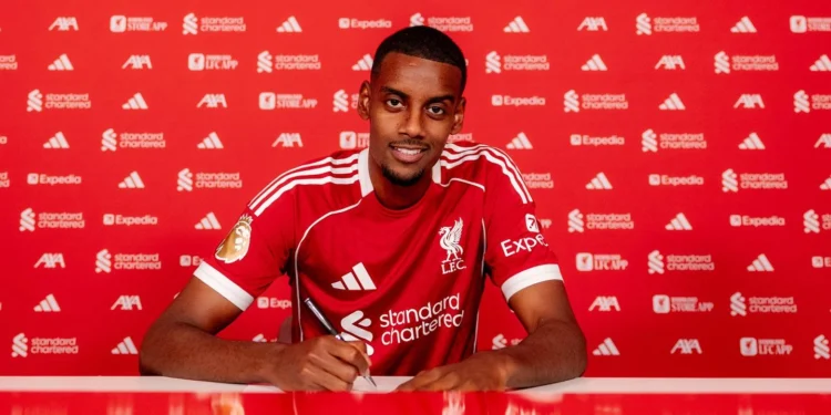 Alexander Isak signs his contract at the AXA Training Centre after completing his move to Liverpool FC.