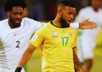 Nigeria’s Ola Aina challenges South Africa’s Sipho Mbule during their World Cup qualifier at the Free State Stadium in Bloemfontein.