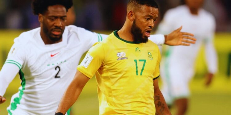 Nigeria’s Ola Aina challenges South Africa’s Sipho Mbule during their World Cup qualifier at the Free State Stadium in Bloemfontein.
