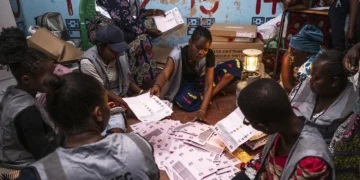 Election volunteers count ballots in Blantyre, Malawi, Tuesday, Sept. 16, 2025. (AP Photo/Thoko Chikondi)