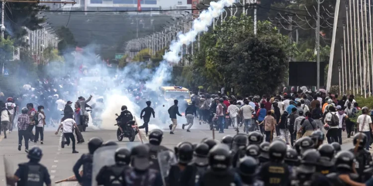 Riot police personnel fire tear gas to disperse demonstrators during a protest outside the Parliament in Kathmandu on September 8, 2025. Prabin Ranabhat/AFP/Getty Images