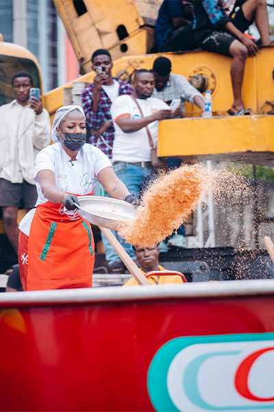 Nigerian chef Hilda Baci serves the world’s largest Nigerian jollof rice to thousands of attendees in Lagos