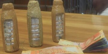 Mercury and cash displayed as exhibits following the arrest of two Zimbabwean nationals in South Africa.