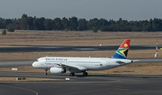 A South African Airways (SAA) flight is seen on the tarmac before departing from the O.R. Tambo International Airport in Johannesburg on September 23, 2021. (Photo by Emmanuel Croset / AFP).