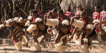 Traditional dancers from the Kingdom of Eswatini performing in full regalia during a cultural celebration.