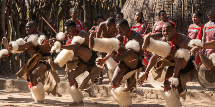 Traditional dancers from the Kingdom of Eswatini performing in full regalia during a cultural celebration.