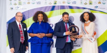 Chargé d’Affaires Marc Weinstock receives an award from Miss Eswatini during the 2025 ICMA Conference in Manzini