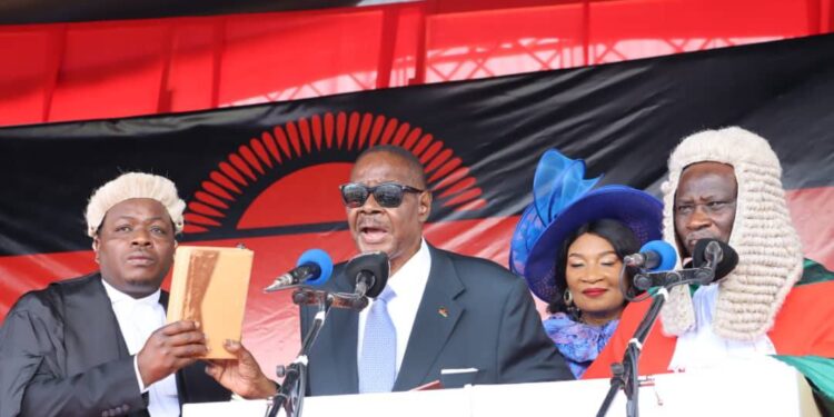 President Arthur Peter Mutharika takes the oath of office during his swearing-in ceremony at Kamuzu Stadium in Blantyre. Photo by Malawi State House