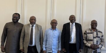 Ras Mubarak poses with Members of Parliament in Maseru following discussions on regional cooperation and free movement across Africa. Photo by Ras Mubarak