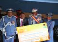 ENFES Chief Fire Officer Luke Lushaba, Minister of Housing and Urban Development Apollo Maphalala presenting the E60 000 cheque to His Majesty King Mswati III.
