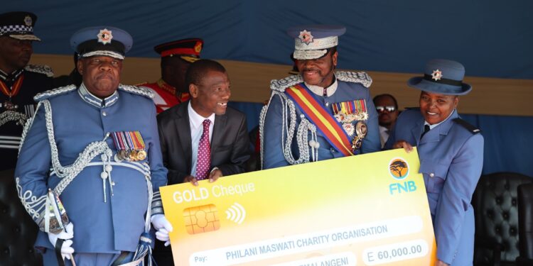 ENFES Chief Fire Officer Luke Lushaba, Minister of Housing and Urban Development Apollo Maphalala presenting the E60 000 cheque to His Majesty King Mswati III.