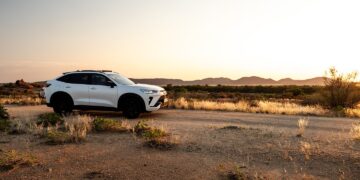 Coupe-styled Haval H6 GT PHEV on the open road showcasing its sleek design and hybrid performance. Photo by B-Smirk.
