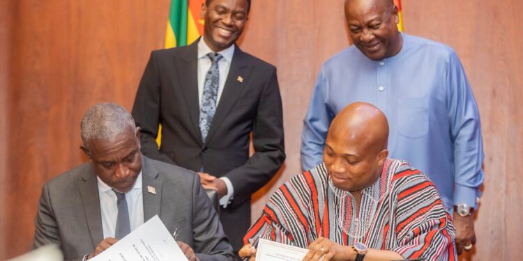 Ghana’s Foreign Affairs Minister Samuel Okudzeto Ablakwa and Grenada’s Foreign Minister Joseph Andall sign the nurse recruitment agreement as President John Dramani Mahama and Prime Minister Dickon Mitchell of Grenada look on.