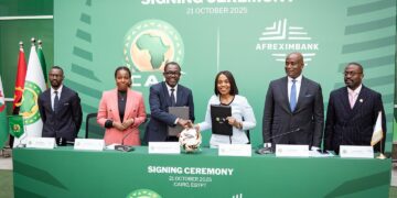 Afreximbank Executive Vice President Kanayo Awani and CAF Secretary General Véron Mosengo-Omba exchange the Memorandum of Understanding and Partnership Agreement to advance Africa’s sports sector. Photo by African Export Import Bank - Afreximbank
