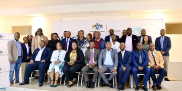 Minister Appolo Maphalala poses with mayors, council chairpersons, and urban development partners at the World Cities Day 2025 event in Mbabane.