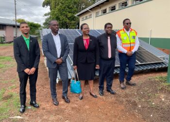 Officials from the Ministry of Labour and Social Security and ESERA pose with Solar Photovoltaic equipment during the handover ceremony at DIVT.