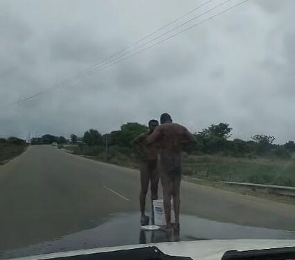 Two men bathing publicly. | Pic, Siphosakhe Banele Ndoni/Facebook