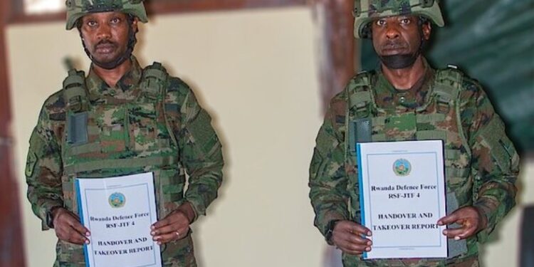 Major General Emmy K. Ruvusha (left) hands over command of the Rwanda Security Forces in Cabo Delgado to Major General Vincent Gatama during the ceremony in Mocímboa da Praia.