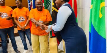 Philile Sibandze receives her prize itinerary. | Pic, Sebenzile Bhembe