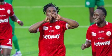 Simba SC players celebrate after scoring against Nsingizini Hotspurs