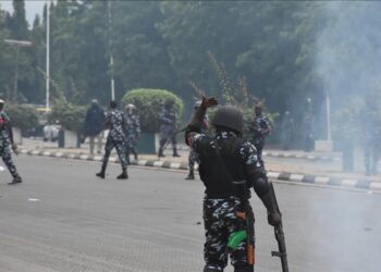 Nigerian police officers confront protesters during a demonstration in Abuja demanding the release of detained Biafra leader Nnamdi Kanu.