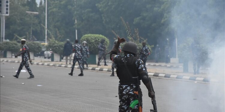 Nigerian police officers confront protesters during a demonstration in Abuja demanding the release of detained Biafra leader Nnamdi Kanu.