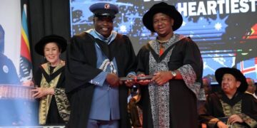 Eswatini National Fire and Emergency Services PRO Mandla C. Dlamini shares a moment with the Minister of Labour and Social Security, Hon. Phila Buthelezi, during the Limkokwing University graduation ceremony.