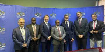 Minister Manqoba Khumalo standing with the DGRV team ahead of the Cooperative Bank development conference.