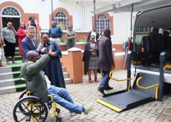 A person with a disability tries out one of the new vehicles as Deputy Prime Minister Thulisile Dladla and Taiwan Ambassador Jeremy Liang observe. Photo by DPM Office