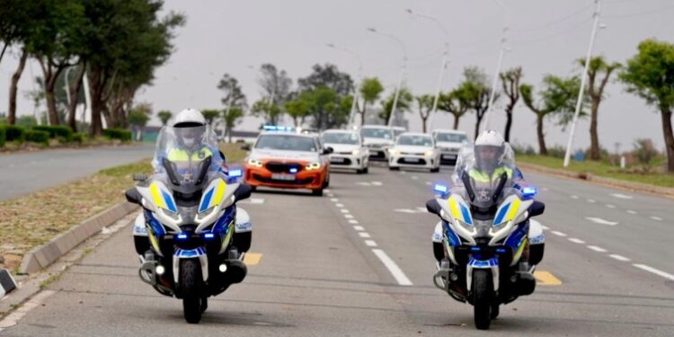 A G20 convoy moves through Johannesburg under heavy police and military protection during the summit.