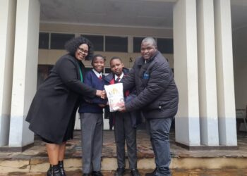 Two students receive seed packages as part of the Green Schools Initiative, supported by the Eswatini Environment Authority. Photo credit: Eswatini National Commission for UNESCO.