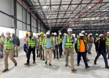 Minister Manqoba Khumalo and stakeholders tour the nearly completed Jonsson Workwear factory in Nhlangano.