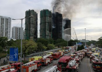 The damaged towers of Wang Fuk Court housing estate, in Tai Po, Hong Kong, China, November 27, 2025. REUTERS/Tyrone Siu
