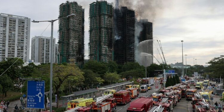 The damaged towers of Wang Fuk Court housing estate, in Tai Po, Hong Kong, China, November 27, 2025. REUTERS/Tyrone Siu