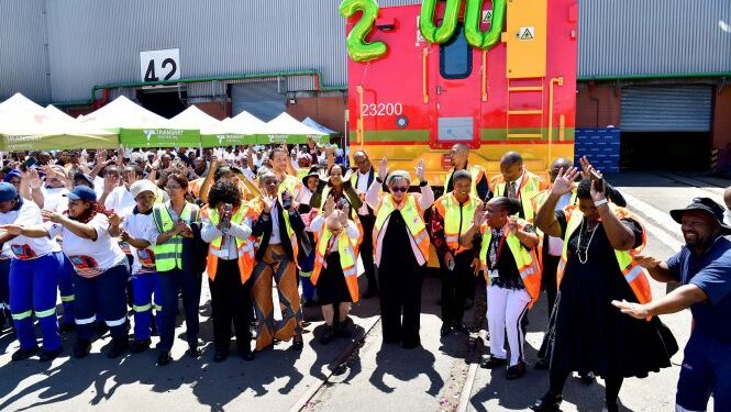 The 200th Traxx 23E locomotive with the Transnet and Alstom team in Durban. 📸: Alstom