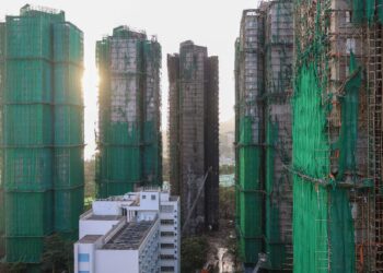 Charred remains of multiple residential towers following a deadly fire on Wednesday at Wang Fuk Court housing complex, in Tai Po, Hong Kong, China, November 29, 2025. REUTERS/Tyrone Siu