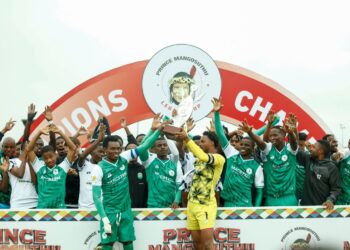 The captains of AmaZulu FC and Nsingizini Hotspurs stand with their team members proudly holding the shared 2025 Prince Mangosuthu Legacy Cup trophy