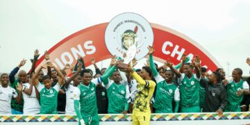 The captains of AmaZulu FC and Nsingizini Hotspurs stand with their team members proudly holding the shared 2025 Prince Mangosuthu Legacy Cup trophy