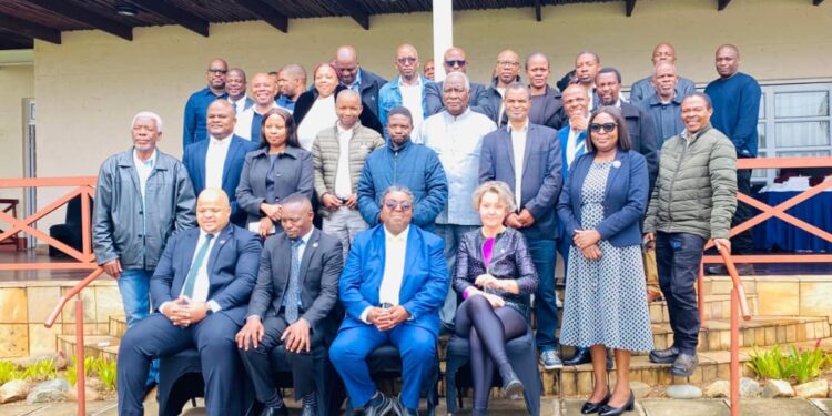 Ministry of Agriculture Sydney Simelane has a photo opportunity with National Drought Plan review attendees. Pic, InsideBiz