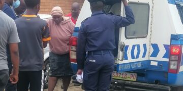 The mother being assisted into a police van. (Pic, Sithembiso Sihlongonyane)