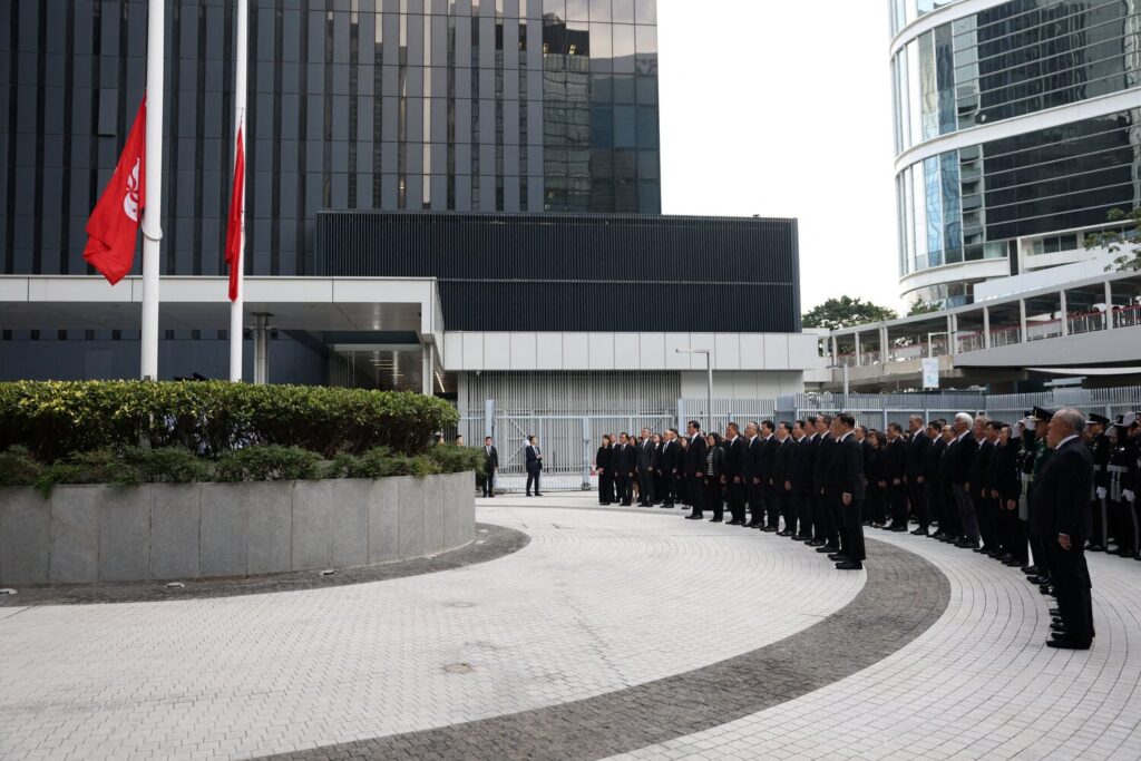 Officials attend a ceremony at Central Government Offices of Hong Kong to mourn victims killed in the deadly fire at the Wang Fuk Court housing complex in Tai Po, in Hong Kong, China, November 29, 2025. REUTERS/Maxim Shemetov