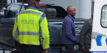 Mzwandile Mabuza is led into a police van after the court ruling on his drunken driving case