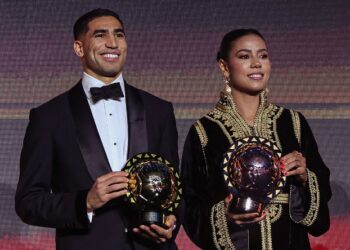 Achraf Hakimi and Ghizlaine Chebbak pose together after winning the CAF Player of the Year awards. Photo by CAF