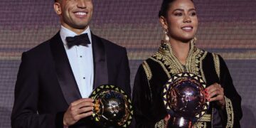 Achraf Hakimi and Ghizlaine Chebbak pose together after winning the CAF Player of the Year awards. Photo by CAF
