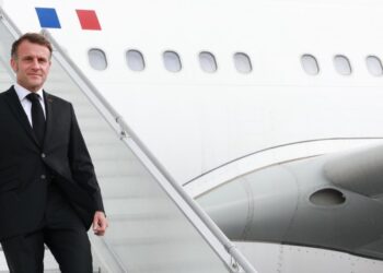 French President Emmanuel Macron disembarks from the plane upon his arrival at OR Tambo International Airport in Johannesburg. Photo by X/@PresidencyZA.