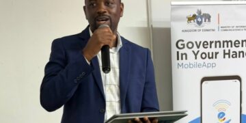 Mr. Bonga Ndlangamandla, e-Government Director at the Ministry of ICT, addresses students and guests at the IRDM College Job Fair in Mbabane.