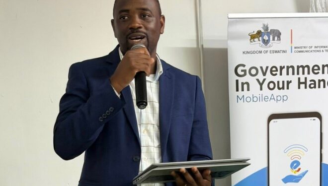 Mr. Bonga Ndlangamandla, e-Government Director at the Ministry of ICT, addresses students and guests at the IRDM College Job Fair in Mbabane.
