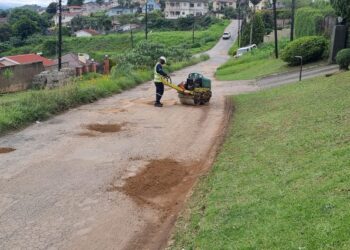 A worker filling potholes on Lukhozi Street in Thembelihle, Mbabane, during recent repairs. Photo by Adekunle Owolabi.